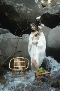 Serene Asian Beauty: A Delicate Moment with a White Flower-5