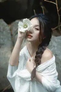 Serene Asian Beauty: A Delicate Moment with a White Flower-1