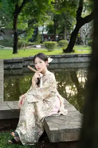 East Asian Traditional Beauty: Gentle Young Woman in Ao Dai with Elegant Wooden Fan-18