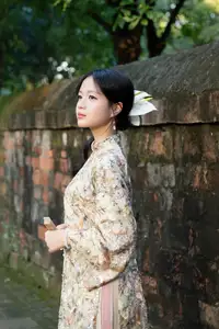 East Asian Traditional Beauty: Gentle Young Woman in Ao Dai with Elegant Wooden Fan-2