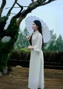 Graceful Vietnamese Woman in White Ao Dai with Lotus Flower in Serene Garden-4