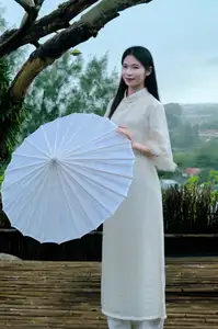 Graceful Vietnamese Woman in White Ao Dai with Lotus Flower in Serene Garden-5