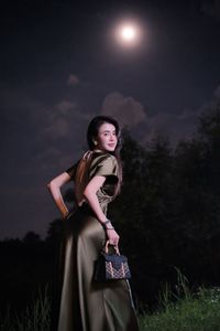 Enigmatic Beauty Under Full Moonlight: Woman in Elegant Silk Gown, A Dreamlike Night Moment.-2