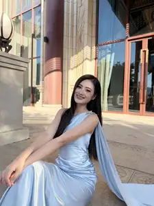 Miss Ý Nhi Radiates Elegance: A Vision in Her Sophisticated Evening Gown on Grand Ancient Stairs-1
