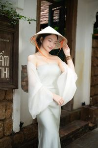 Graceful Vietnamese Girl in Traditional Conical Hat-5