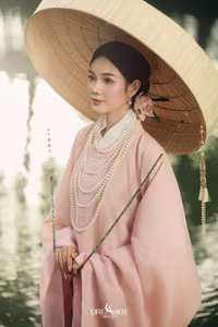 XVG No.50: Elegant Vietnamese Woman in Pink Traditional Dress, Conical Hat, Serene Beauty.-7