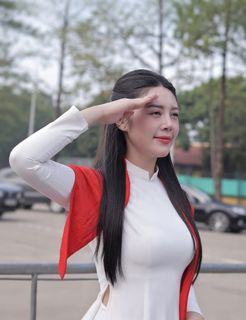Elegant Vietnamese Woman in White Ao Dai Embracing Spirit of Independence-6