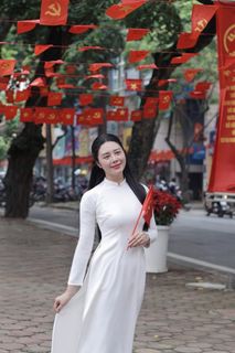Elegant Vietnamese Woman in White Ao Dai Embracing Spirit of Independence-7