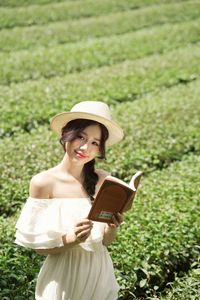 Serene Girl Embracing Nature & Book in Lush Green Tea Hill-12