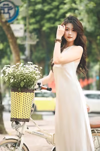 VGU No.54: Elegant Vietnamese Girl with White Chrysanthemums, A Gentle Moment by Bicycle Amidst Greenery.-4