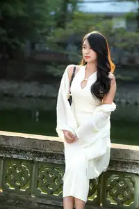 Elegant Beauty in Pristine White Dress Under Golden Afternoon Sun 1000027006-0