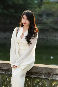 Elegant Beauty in Pristine White Dress Under Golden Afternoon Sun 1000027006-6