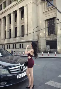 Charming Woman in Elegant Burgundy Mini Dress Defines Urban Street Style-4