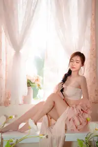 Ethereal Beauty: A Young Woman's Delicate Charm in a Flowing Pink Dress-14