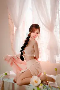 Ethereal Beauty: A Young Woman's Delicate Charm in a Flowing Pink Dress-13