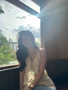 Natural Beauty: Serene Portrait of a Young Woman in Warm Sunlight-0