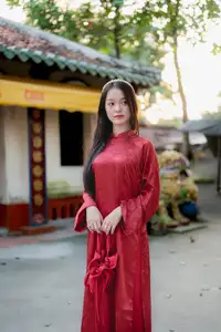 Elegant Vietnamese Beauty in Red Ao Dai: A Glimpse into Traditional Grace-9