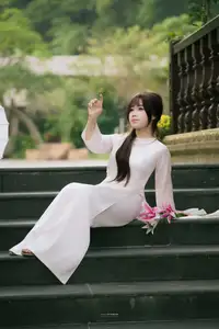 Graceful Vietnamese Girl in Traditional Attire by Ancient Architecture | Discover Asian Beauty and Cultural Charm-6