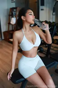 Model FE's captivating gym style in sleek white athletic wear | XiuRen No.10621-31