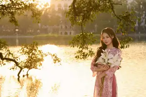Gentle Vietnamese Beauty: Pink Ao Dai by the Lake, with Pure Lilies-2