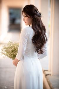 Graceful Vietnamese Girl in Pristine White Ao Dai: Timeless Beauty.-8