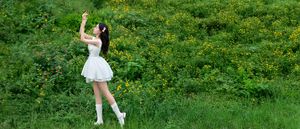 Elegant Young Woman in White Dress Amidst Greenery | Natural Summer Beauty-3