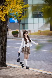 Young Asian Girl in Plaid Skirt Embracing Autumn Foliage-10