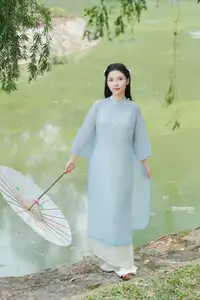 Elegant Vietnamese Maiden in Áo Dài Amidst Serene Nature's Embrace-10