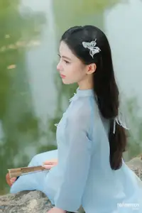 Elegant Vietnamese Maiden in Áo Dài Amidst Serene Nature's Embrace-4