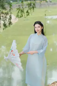Elegant Vietnamese Maiden in Áo Dài Amidst Serene Nature's Embrace-14
