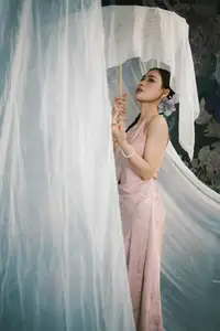 Discover Vietnamese Grace: An Elegant Girl in Ao Yem with a Red Fan.-2