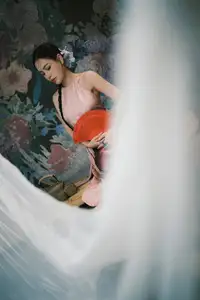 Discover Vietnamese Grace: An Elegant Girl in Ao Yem with a Red Fan.-0