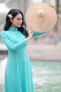 Vietnamese Ao Dai Beauty: Graceful Girl with Flowers.-0