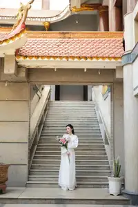 Serene Vietnamese Beauty: A Gentle Muse in White with Pink Lilies-9