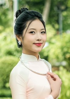 Capturing the Timeless Elegance of Vietnamese Women: A Journey Through Traditional Ao Dai Fashion and Faded Pink Hues-4