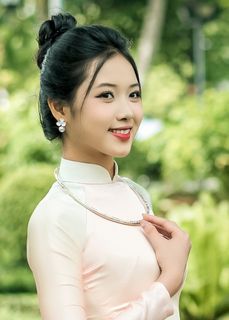 Capturing the Timeless Elegance of Vietnamese Women: A Journey Through Traditional Ao Dai Fashion and Faded Pink Hues-5