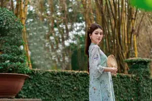 Graceful Ao Dai Girl Amidst Bamboo: Timeless Beauty and Serenity-5