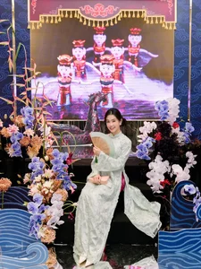 Timeless Elegance: Ngọc Thảo Radiates Grace in a Traditional Blue Vietnamese Ao Dai Amidst Artistic Heritage-1