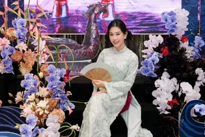 Timeless Elegance: Ngọc Thảo Radiates Grace in a Traditional Blue Vietnamese Ao Dai Amidst Artistic Heritage-5