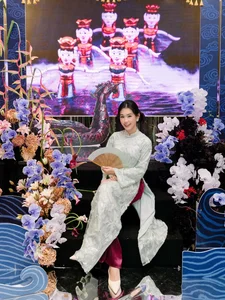 Timeless Elegance: Ngọc Thảo Radiates Grace in a Traditional Blue Vietnamese Ao Dai Amidst Artistic Heritage-0