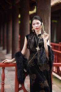Captivating Asian Beauty in an Elegant Black Velvet Cheongsam-5