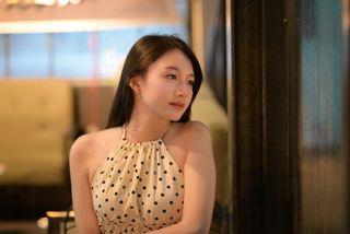 Elegant Beauty of a Young Vietnamese Girl in a Cafe Setting-0