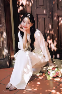 VGU No.131: Graceful young woman in traditional dress, timeless Vietnamese beauty against ancient brick.-1
