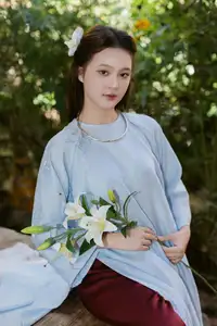 Serene Beauty: Graceful Young Woman in Traditional Attire with White Lilies-3