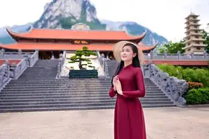 Graceful Vietnamese Ao Dai: Serene Beauty at Majestic Mountain Temple-0