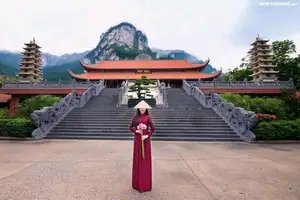 Graceful Vietnamese Ao Dai: Serene Beauty at Majestic Mountain Temple-1