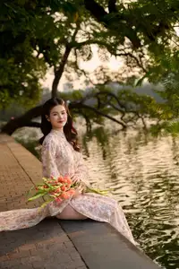 Vietnamese Ao Dai Beauty by the Lake at Sunset: Graceful Girl with Vibrant Gladiolus Flowers.-0