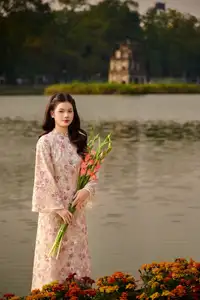 Vietnamese Ao Dai Beauty by the Lake at Sunset: Graceful Girl with Vibrant Gladiolus Flowers.-2