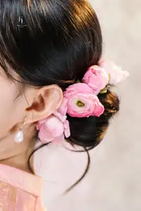 Elegant Asian Charm: Serene Young Woman in Traditional Pink Attire with Delicate Fresh Flowers-5