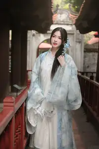 Graceful Vietnamese Girl in Traditional Attire Amidst Ancient Temple Architecture-0